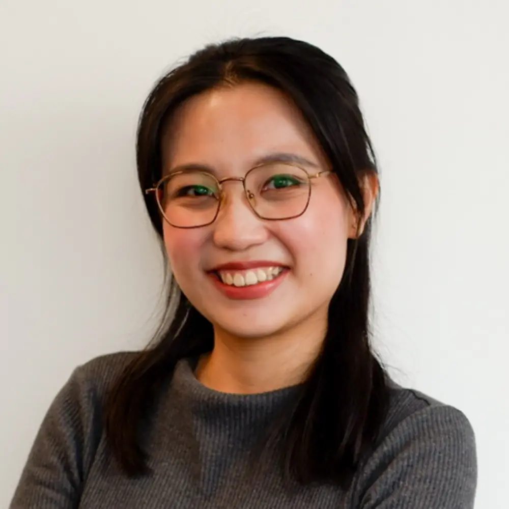 A portrait photo of Kimberly Ang that shows her smiling into the camera.